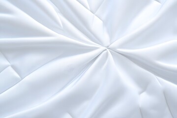 Smooth, white fabric elegantly draped, creating a visually appealing radial pattern