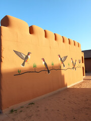 Tucume Peru, replica of the adobe wall in local museum with painted birds