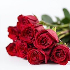 Obraz premium Fresh Red Roses Bouquet Arrangement for Romantic Occasions and Special Celebrations with Vibrant Green Leaves Accenting the Beautiful Flowers