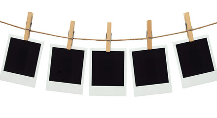 A row of five Polaroid frames pinned on a rope with clothespins, showcasing simplicity and an anticipation of cherished memories, isolated on white or transparent background. PNG