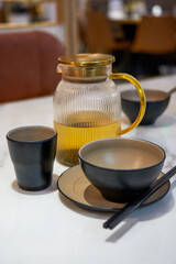 Close-up of tableware teapots for diners in a restaurant