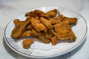 A plate of fried crispy fish bones