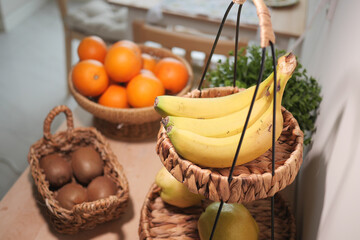 Fresh fruits displayed in woven baskets on a wooden table
