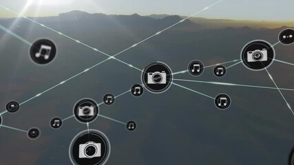 Digital media network floating across mountain landscape, linking camera and music icons - Powered by Adobe