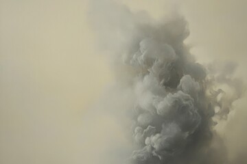 A pale, smoky plume ascends against a muted backdrop.