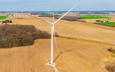 Wind Turbines Over Farmland Generating Green Energy