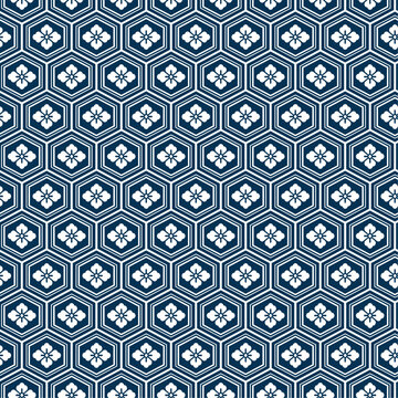 Hanabishi Kikko Japanese seamless pattern. Traditional hexagon and floral motif background in navy blue. Repeating geometric textile design for fabric, print, and decorative use