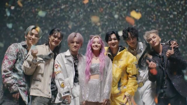 Vibrant Ensemble: A captivating portrait captures a youthful, diverse group united in a striking and artful display of camaraderie. Their faces radiate joy and excitement.