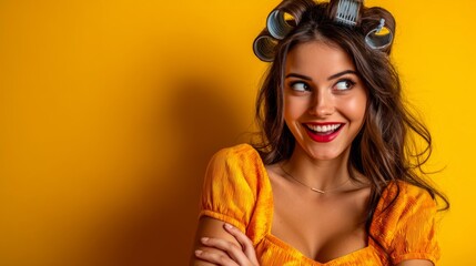 Smiling woman with hair rollers and bright yellow background