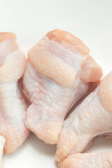 Fresh Raw Chicken Wing Stick Or Chicken Drumettes On White Background. Top view.