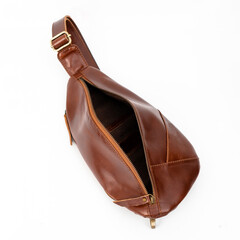 Blank and open black leather sling bag isolated on white background, perfect for leather product...