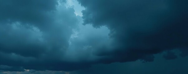 Imposing, dark storm clouds gather, heavy with rain ,  landscape,  sky,  moody