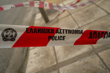 police tape from Geece , greek police ribbon  in the streets of Thessaloniki