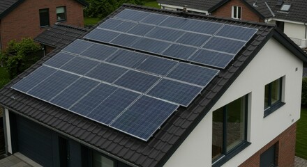 Fototapeta premium Solar panels on a modern house roof