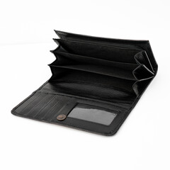 Empty open black leather wallet isolated on white background