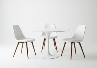 White round table with tulip base and chairs isolated on light background