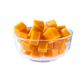 cheddar cheese cut into cubes in transparent glass bowl isolated on white background .