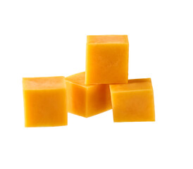 cheddar cheese sliced ​​into cubes isolated on white background.