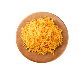 grated cheddar cheese on a cutting board isolated on a white background, top view.