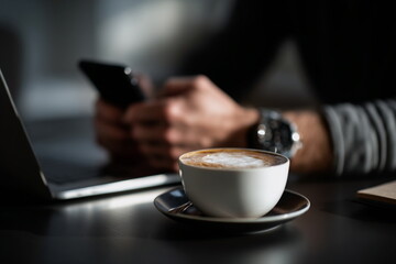 Coffee fuels concentration in this cozy workspace shot. Ideal for illustrating remote jobs, online entrepreneurship, or digital workflow routines.

