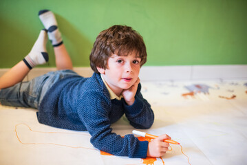 Child engaging in creative art activity at home