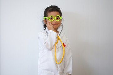 Happy asian child girl medical assistant in clinic. Nurse in uniform doctor at hospital 
