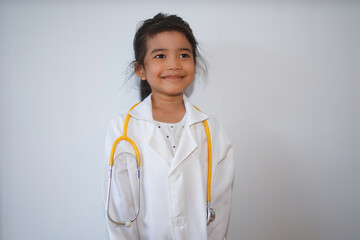 Happy asian child girl medical assistant in clinic. Nurse in uniform doctor at hospital 
