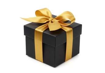 A black box with a gold ribbon and bow on a white background studio