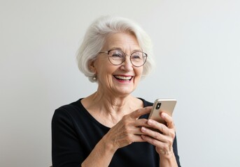 Fototapeta premium Smiling woman with glasses using mobile device in her hands now isolated on white background