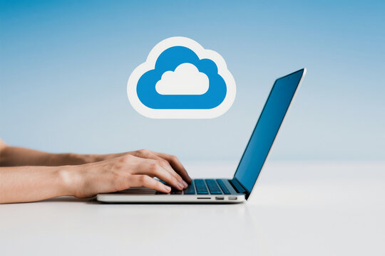 Person typing on a laptop with a cloud icon representing cloud computing technology