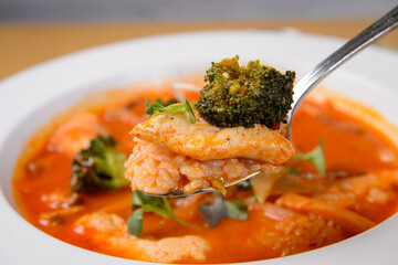 A spoonful of rice in spicy soup
