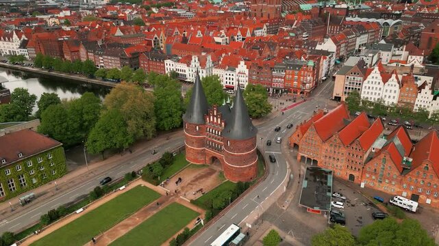 aerial shot arounf holstentor historic gate and salzspeicher revealing the city center of Lubeck on an overcast day, Lubeck city, Schleswig-Holstein land, Germany