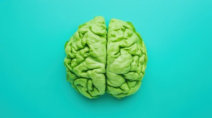 A head of lettuce arranged to resemble a human brain on a turquoise background.