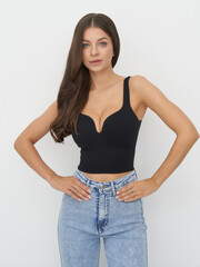 Striking pose of a confident female model in a contemporary fashion studio setting