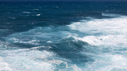 Rocky coast of the Atlantic ocean with waves.