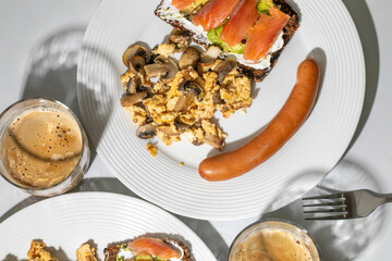 Sizzling breakfast platter with mushrooms, salmon toast, and coffee whispers Oktoberfest brunch...