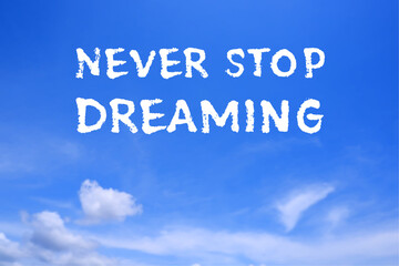 Never Stop Dreaming, text words typography in the blue sky, life and business motivatiobal inspirational concept
