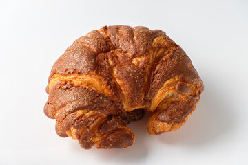 Dark Brown Croissant on a White Background