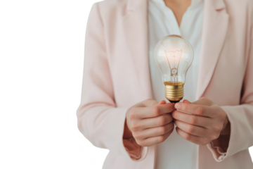 A person in a light suit holds a glowing light bulb, symbolizing innovation and creativity, against a black background. Woman in business, Png, Transparent background
