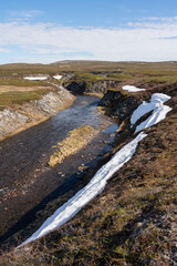 River Gorsajohka flowing in the highlands of Varanger Peninsula. Finmark, Northern Norway