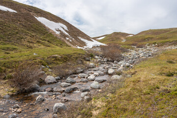 A small rocky creek flowing in the highlands of Varanger Peninsula. Finmark, Northern Norway