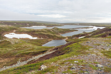 Lake Pettervannet in the highlands of the Varangerhalvøya Natural Park on an early summer day. Vadsø, Finnmark