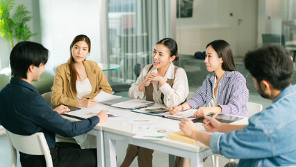 Group of colleagues engaged in business meeting, discussing startup strategies and teamwork in modern office setting, fostering collaboration and ideas. business meeting startup teamwork colleague