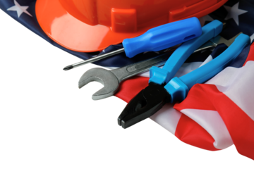 Labor Day features tools and a hard hat on an American flag, isolated on white, PNG