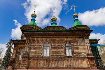 Holy Trinity Cathedral in Karakol city, Kyrgyzstan. Wooden church, architecture. Kyrgyzstan Diocese...