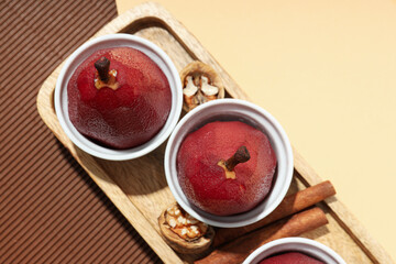 Tasty and delicious food concept - pear in wine