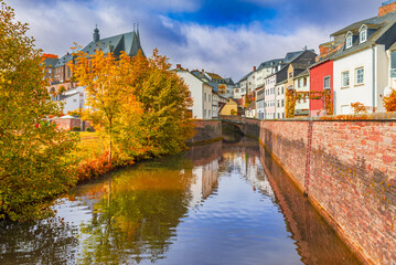 Saarburg, Germany. Old town and Saar River reflection, autumn colors.