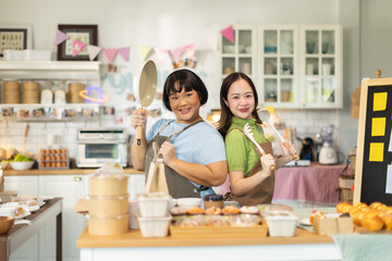 Small business owners are selling .Asian bakery  cake shop owner enjoy posting picture and review her cake on social media or online marketing streaming publish for advertising small business .
