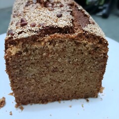 Moist and dense carrot cake made with whole wheat flour and healthy seeds on top, perfect for a guilt-free indulgence.