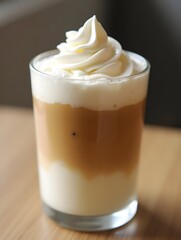 Creamy layered coffee with whipped topping.